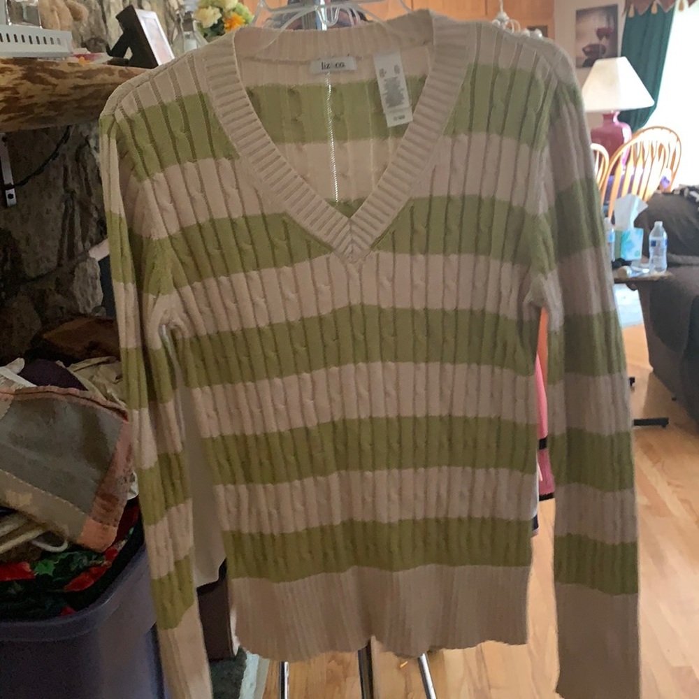 Green and white knitted sweater